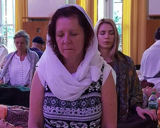 Sat Nam Rasayan person doing meditation outdoors